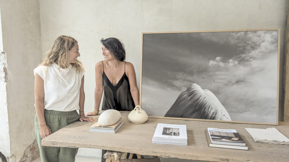 Black-and-white horse photograph from BERNI by Emilia Brandão Carneiro, displayed on a wooden table at Lorna de Santos’s Madrid studio